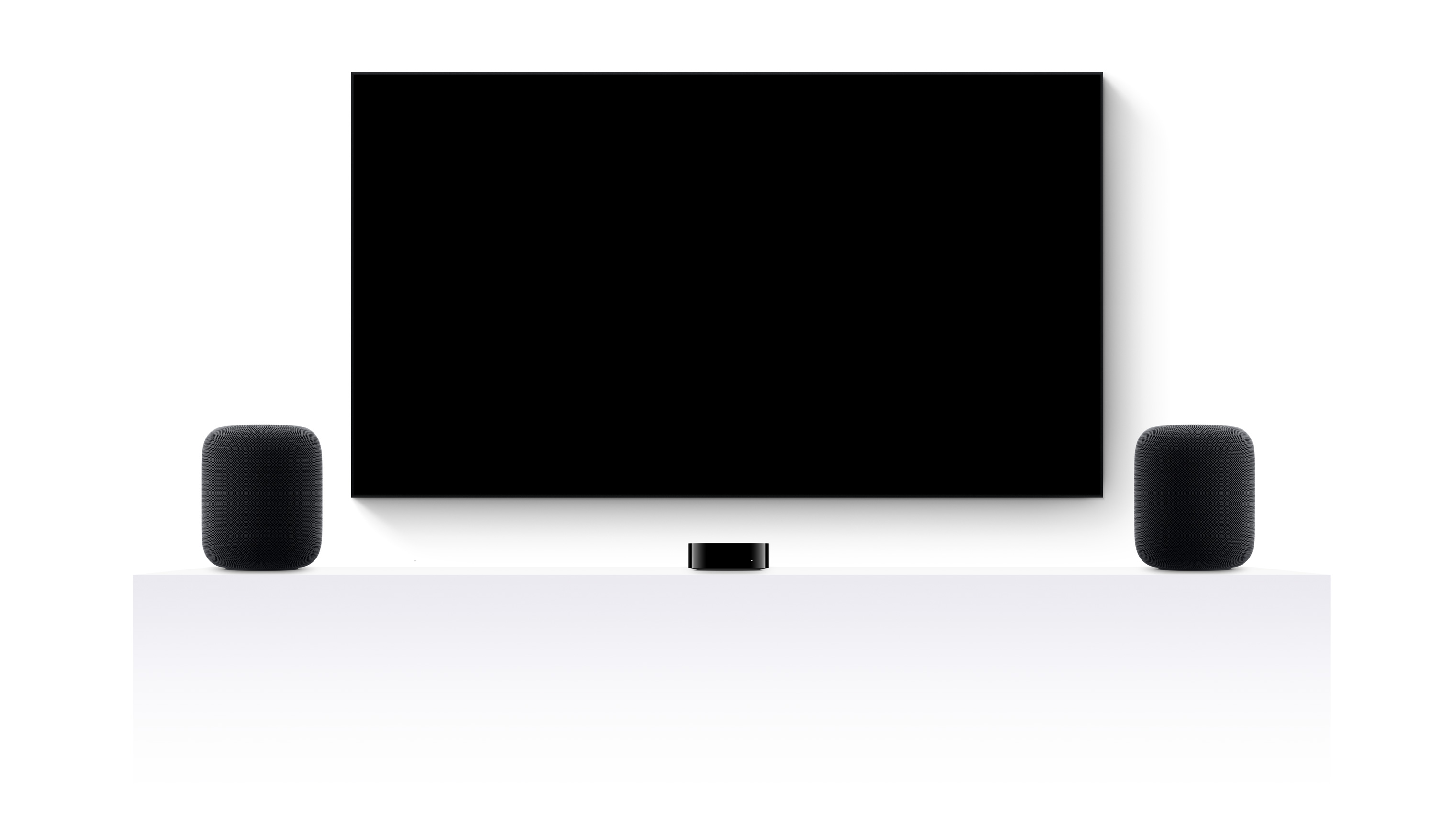 Apple TV 4K, twee HomePods en een flatscreen-tv met een trailer van verschillende films en series van Apple TV+