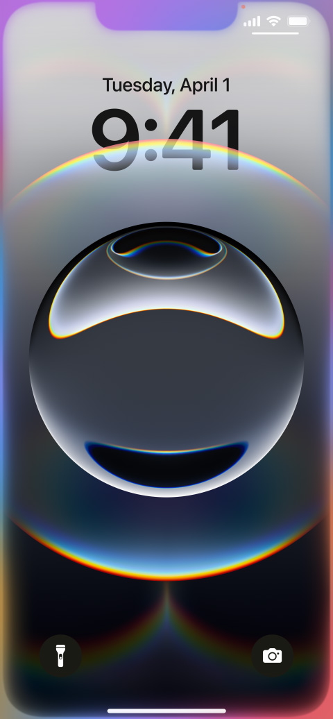 Hand holding iPhone 16e with colorful glowing edges around the Lock Screen.